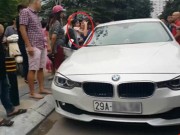 Tin tức - Bố dùng búa đập vỡ kính xe BMV để giải cứu con gái