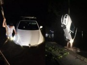 Tin tức - Mải dùng điện thoại, tài xế lao thẳng xe BMW xuống hồ