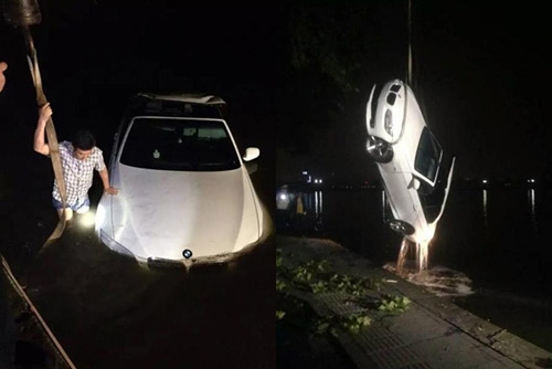 Mải dùng điện thoại, tài xế lao thẳng xe BMW xuống hồ - 7