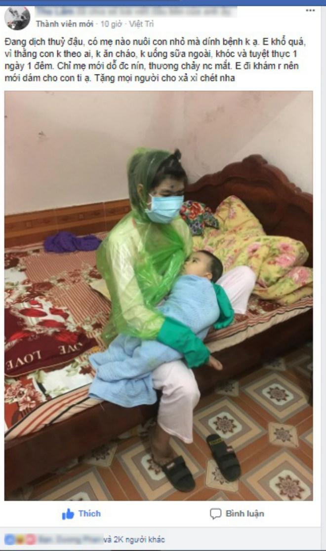 Mẹ bị thủy đậu trùm áo mưa kín người, bịt khẩu trang cho con bú vừa thương vừa buồn cười - 1