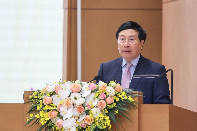 Phó Thủ tướng Thường trực Phạm Bình Minh báo cáo về công tác chỉ đạo, điều hành và kết quả thực hiện kế hoạch phát triển kinh tế - xã hội năm 2021- Ảnh: Nhật Bắc