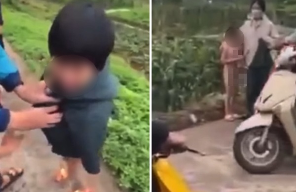 Bé gái chừng 6 tuổi không mảnh vải che thân đứng co ro, khóc mếu bên đường, nhiều người đã lại gần hỏi chuyện và đưa áo cho mặc. (Ảnh cắt từ clip)