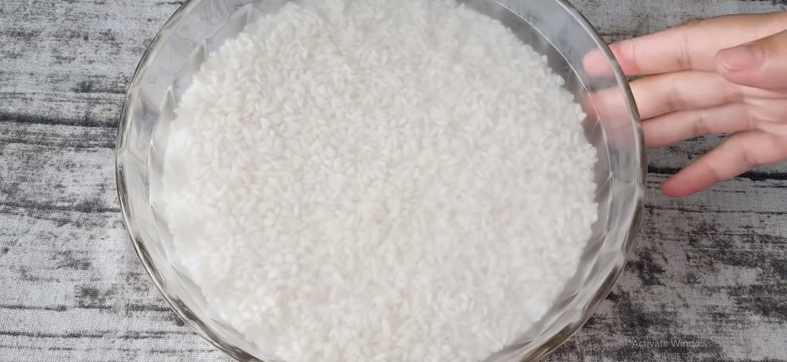 A bowl of rice soaked in water