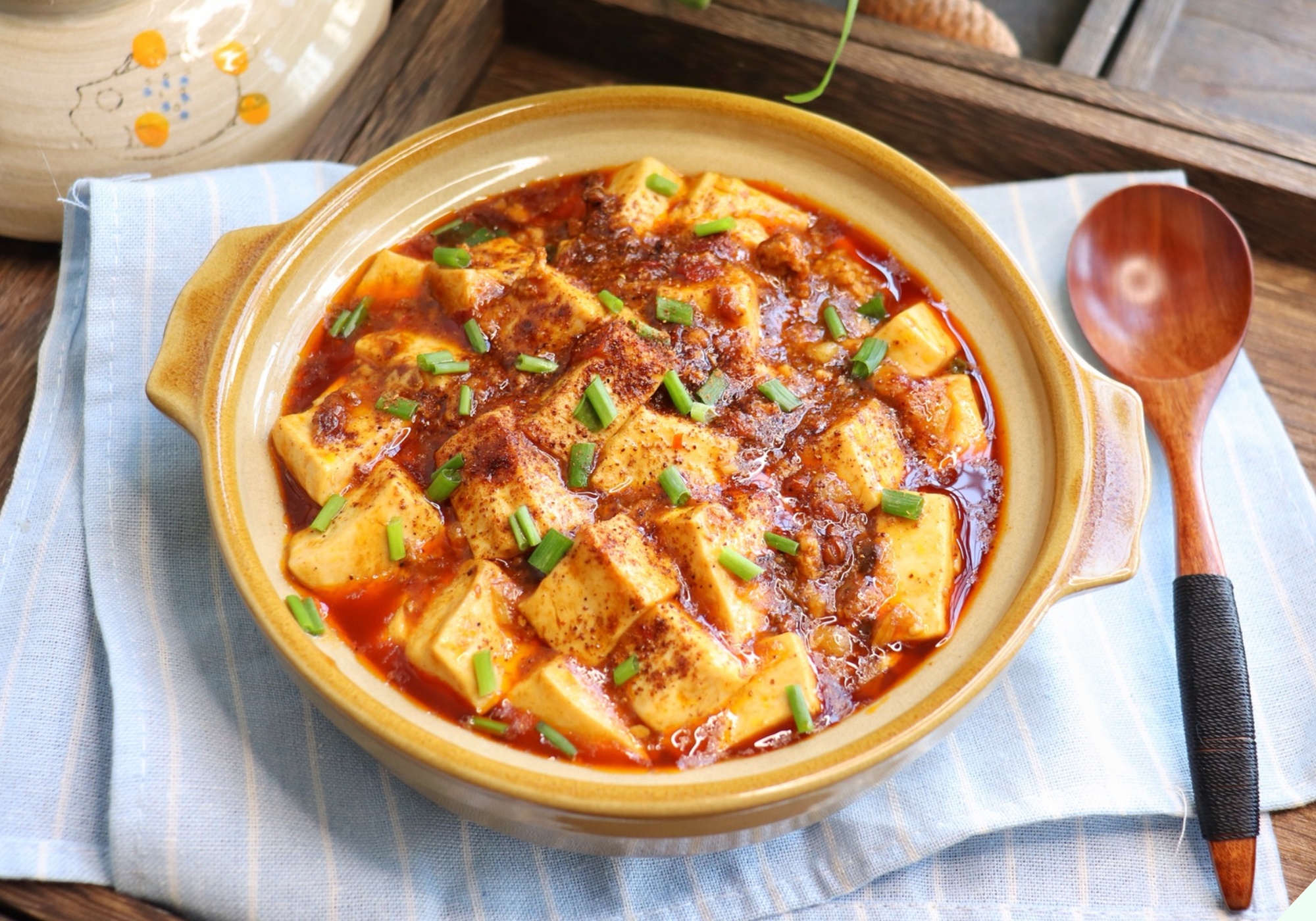 Tofu being fried to a golden crisp