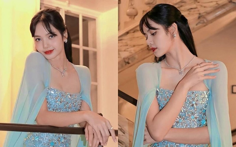 Lisa khoe khéo phong cách ngọt ngào như nàng công chúa tuyết với chiếc đầm dạ hội màu xanh băng giá xuyên thấu tuyệt đẹp. 
