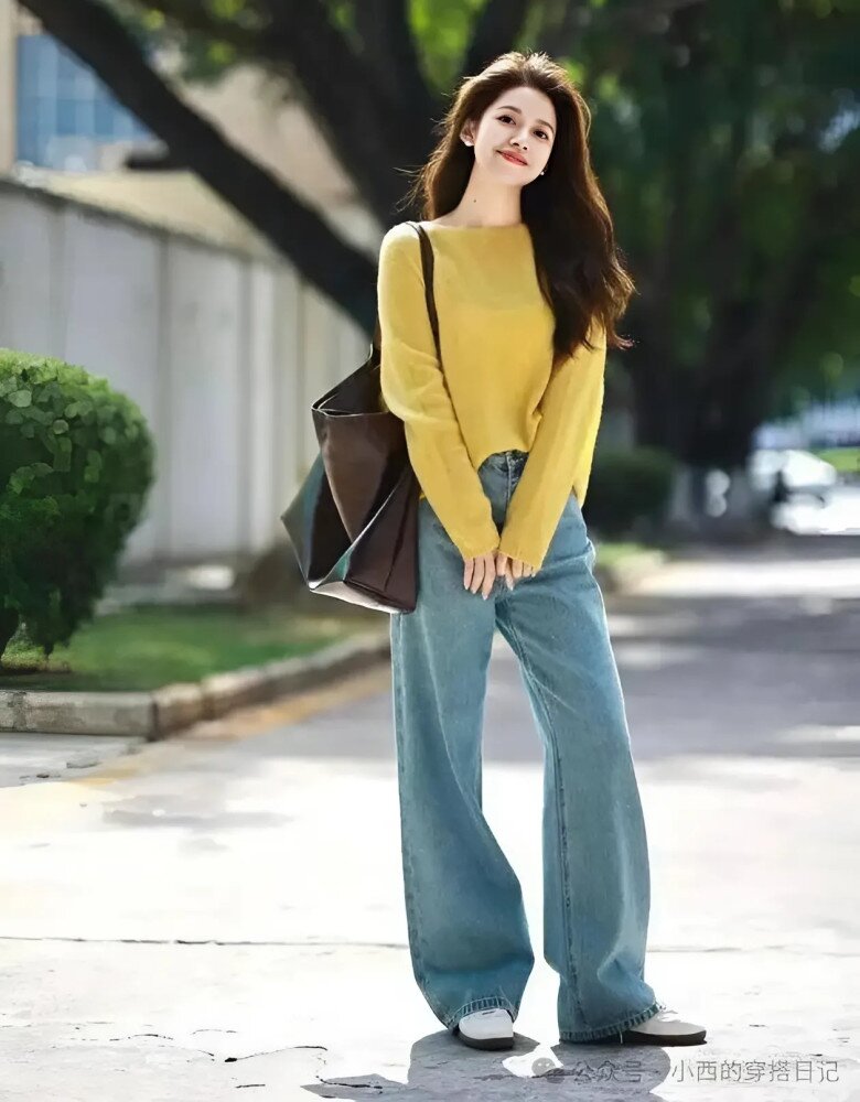 Sự mềm mại của áo len và sự thoải mái của quần jeans đan xen vào nhau, mang đến cho người mặc cảm giác ấm áp và thoải mái. Đôi giày thể thao trắng trên chân hoàn toàn phù hợp với cảm giác nhàn nhã này, tăng thêm nét sống động và trẻ trung cho toàn bộ diện mạo. 