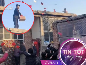 Ông lão đứng trên mái nhà tung mưa lì xì khiến dân mạng thích thú