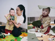 Giải trí - Phương Oanh đưa 2 con về quê ngoại chuẩn bị Tết, cặp sinh đôi mặc áo dài đáng yêu, thích thú khi xem gói bánh chưng