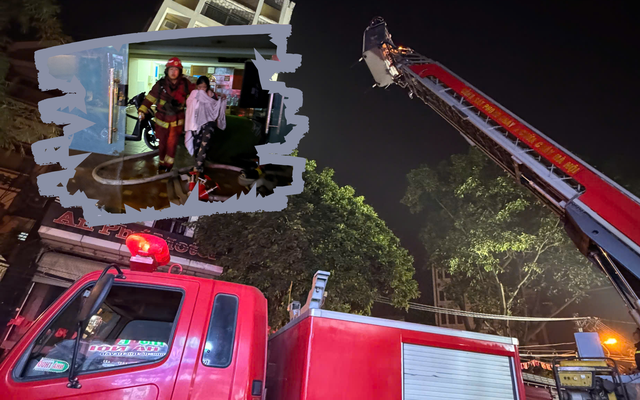 Lực lượng Cảnh sát PCCC và Cứu nạn, cứu hộ Hà Nội triển khai xe thang, đưa bảy người mắc kẹt trong vụ cháy tại một nhà nghỉ ở Hà Đông ra ngoài an toàn.