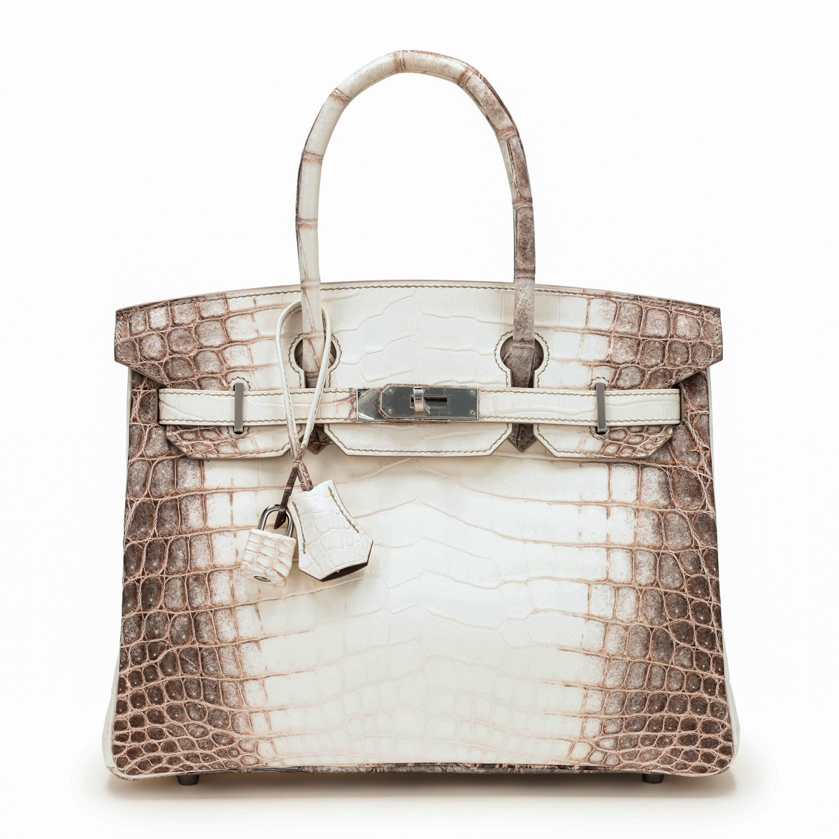 Matte Niloticus Crocodile Himalaya Birkin là dòng túi đẳng cấp hàng đầu của nhà mốt Hermes, được làm từ da cá sấu mang gen đột biến albino ở sông Nile (Ai Cập). Ngoài nguyên liệu quý hiếm, món phụ kiện còn có giá trị bởi khâu chế tác vô cùng kỳ công. Tấm da cá sấu phải trải qua quá trình nhuộm phức tạp để tạo nên màu trắng ngà pha nâu, khắc họa hình ảnh đỉnh núi Himalaya phủ đầy tuyết.