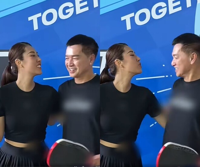 Quang Minh né nhẹ trước nụ hôn của vợ trẻ.