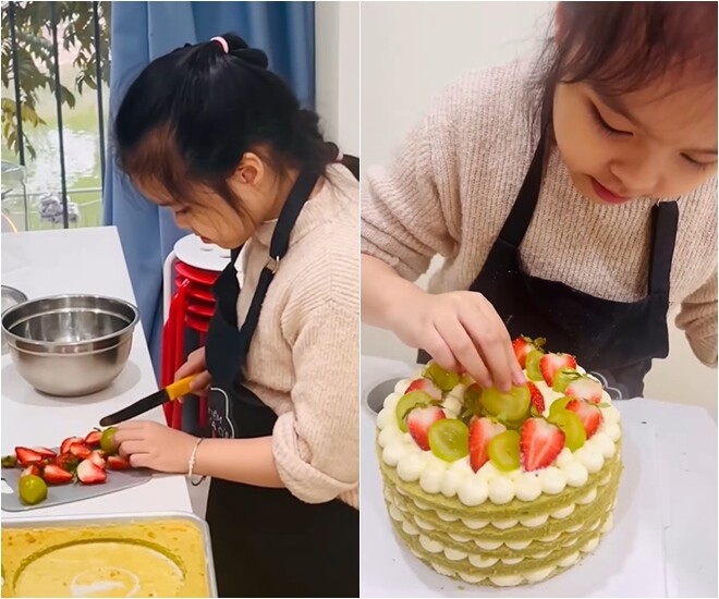Không chỉ giỏi làm bánh, bé Gà còn rất khéo tay trong việc sơ chế trái cây trang trí khi tự tay thái lát dâu tây và nho xanh. Từng miếng trái cây tươi ngon được cô bé xếp đan xen lên mặt bánh tạo nên sự hài hòa về màu sắc.