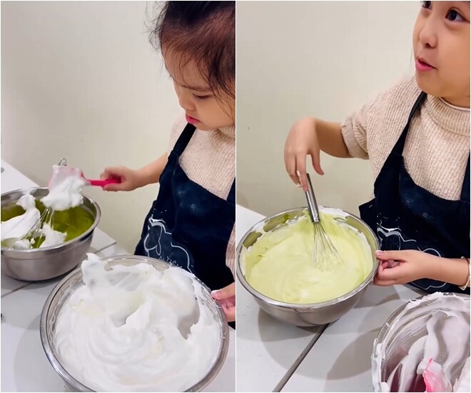 Với sự trợ giúp của phới dẹt, cô nhóc bắt đầu kỹ thuật fold (trộn nhẹ tay) để kết hợp phần lòng trắng đã đánh bông vào hỗn hợp bột lòng đỏ.