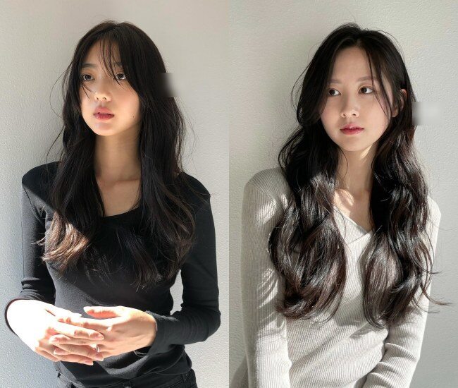 Tóc dài uốn sóng lơi giúp tóc mỏng trông bồng bềnh và có sức sống hơn. Những lọn sóng to tạo hiệu ứng dày tự nhiên, tránh cảm giác xẹp. Khi kết hợp layer nhẹ, kiểu tóc này vẫn giữ nét nữ tính nhưng không làm gương mặt trông già.