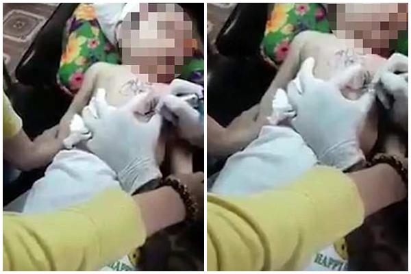 Clip bé trai bị ghì chặt, xăm hình nghệ thuật lên ngực khiến cư dân mạng phẫn nộ - 1
