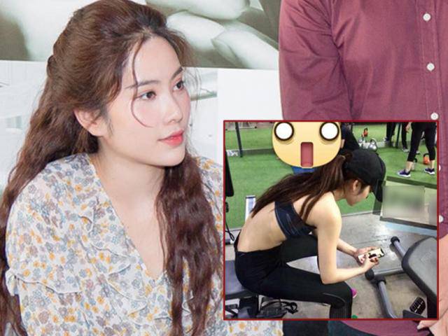 Hình ảnh cô gái được cho là Nam Em đang ngồi xem ảnh Trường Giang tại phòng tập gym