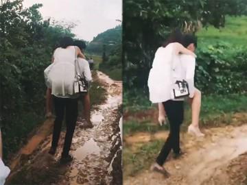 Chàng trai cõng bạn gái đi qua sình lầy tưởng được ngưỡng mộ, ai ngờ bị ném đá dữ dội