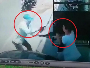 Người phụ nữ tay không, một mình chống trả lại tên cướp có súng