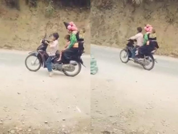 Thót tim cảnh bé trai lái xe máy đèo theo 3 người phóng vù vù trên đường