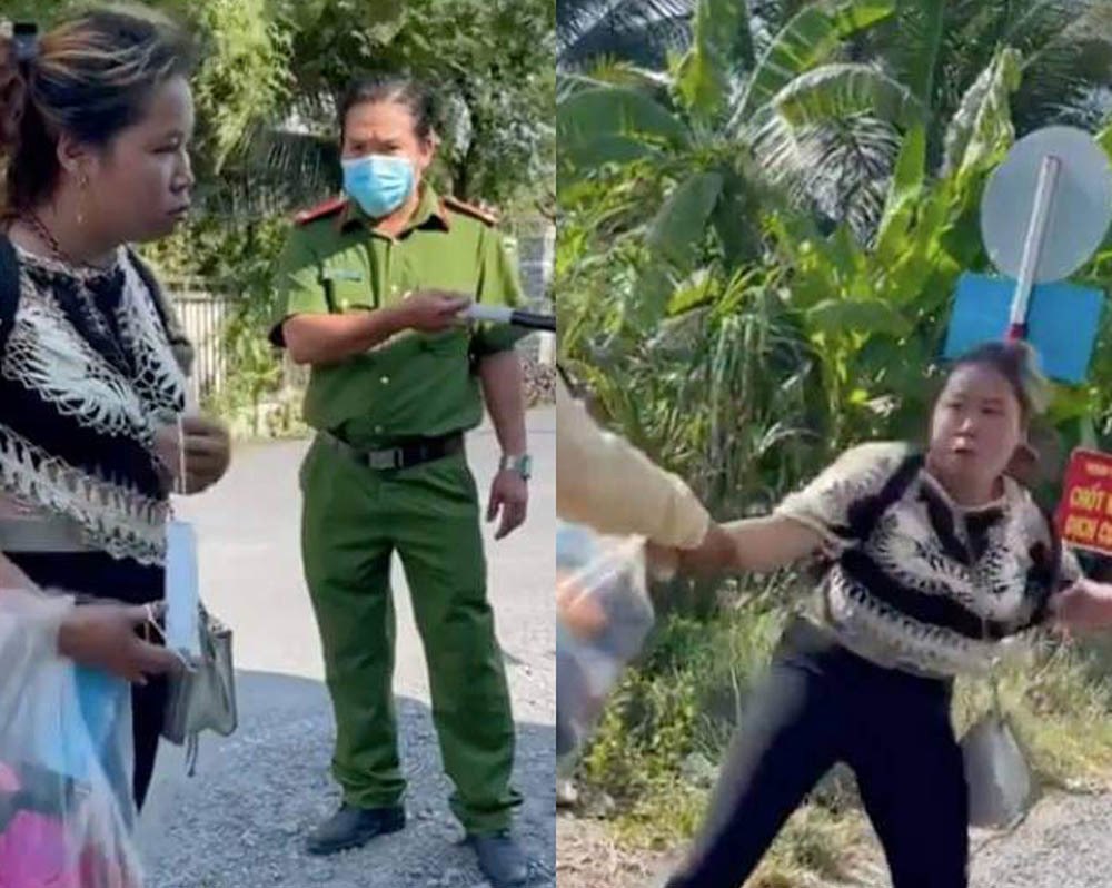 Người phụ nữ cãi cự lại lực lượng chức năng. Ảnh: Vietnamnet