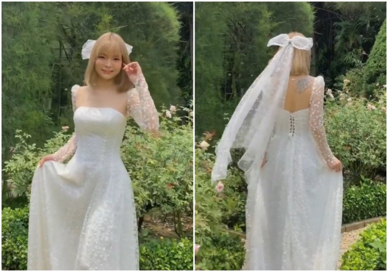 What bride is like Mac Van Khoa's wife, wearing a pristine wedding dress showing off her 