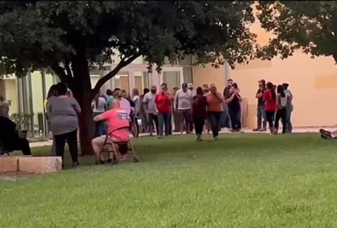 US school shooting: Heartbreaking image of parents waiting for DNA results of dead students - 1