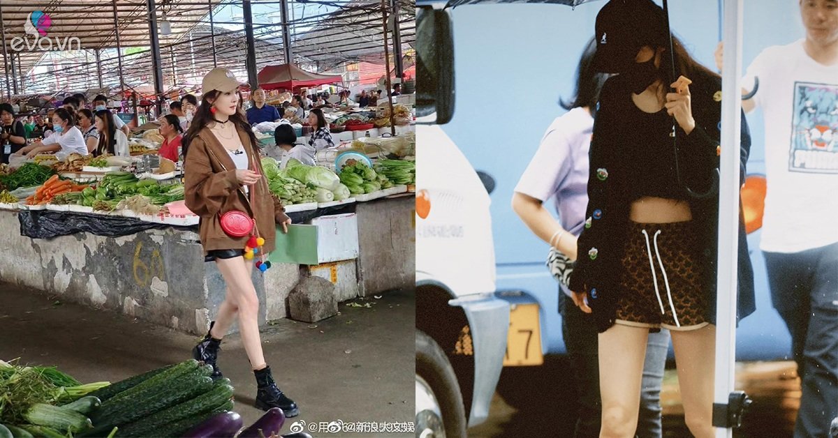 Duong Mi goes to the market, but it’s like striding the catwalk, showing off her famously slim legs