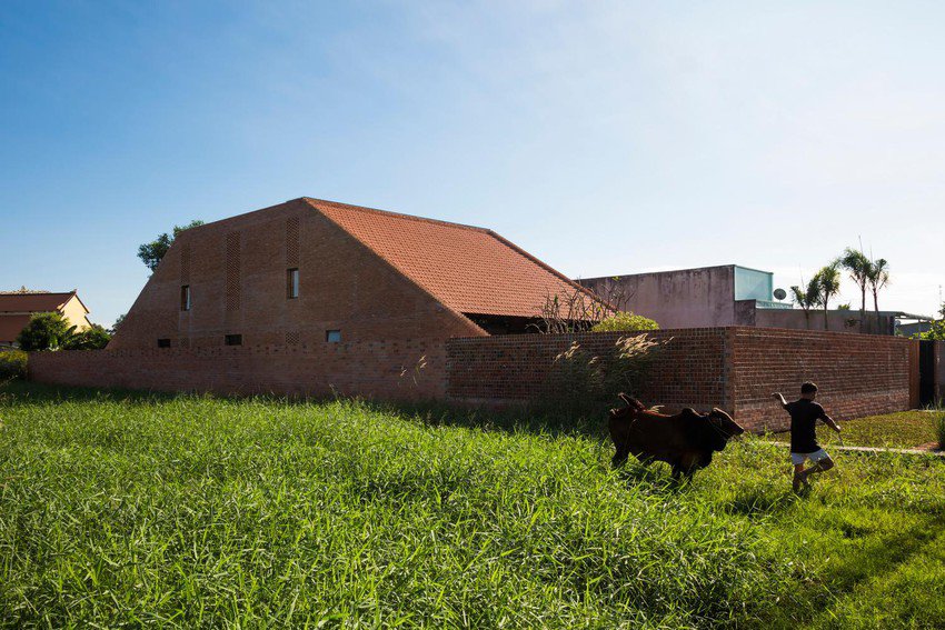 Simple but outstanding red brick house in Long An - 21