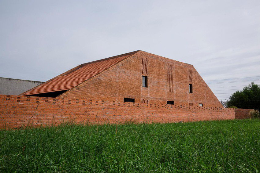 Simple but outstanding red brick house in Long An - 22