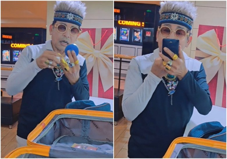 Nam MC vừa đứng trang điểm, vừa trò chuyện với mọi người.