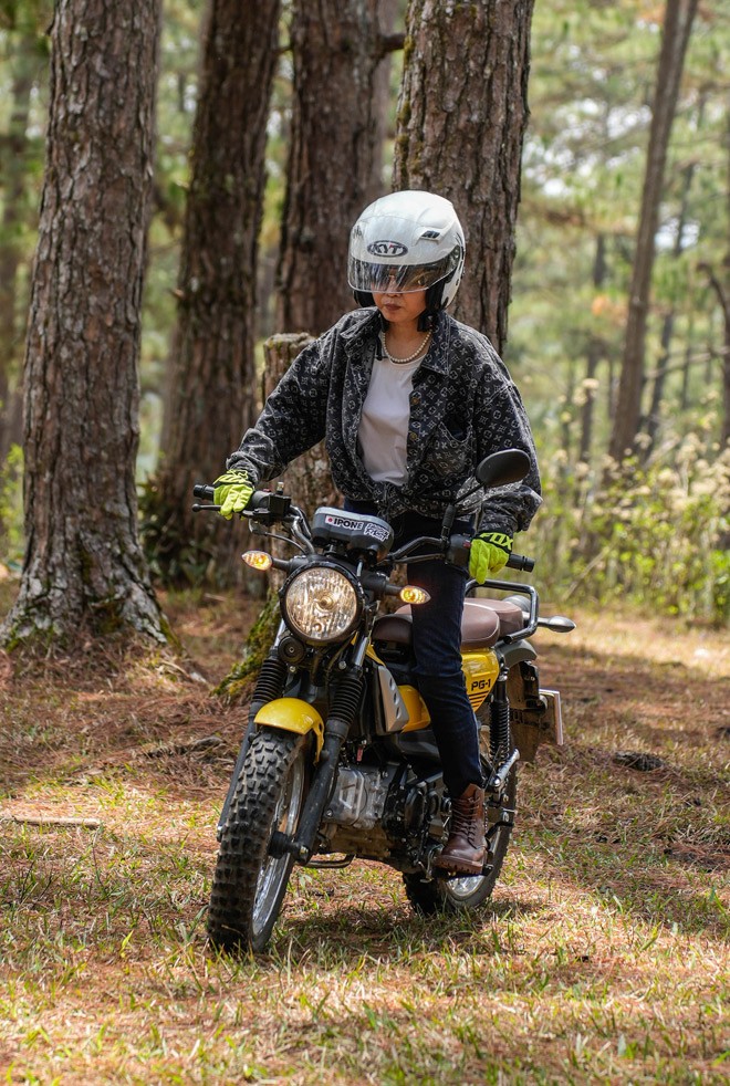 Huy and his mother riding their motorcycles