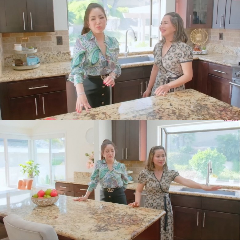 Phòng bếp đầy đủ tiện nghi với nội thất bằng gỗ và đá hoa cương.