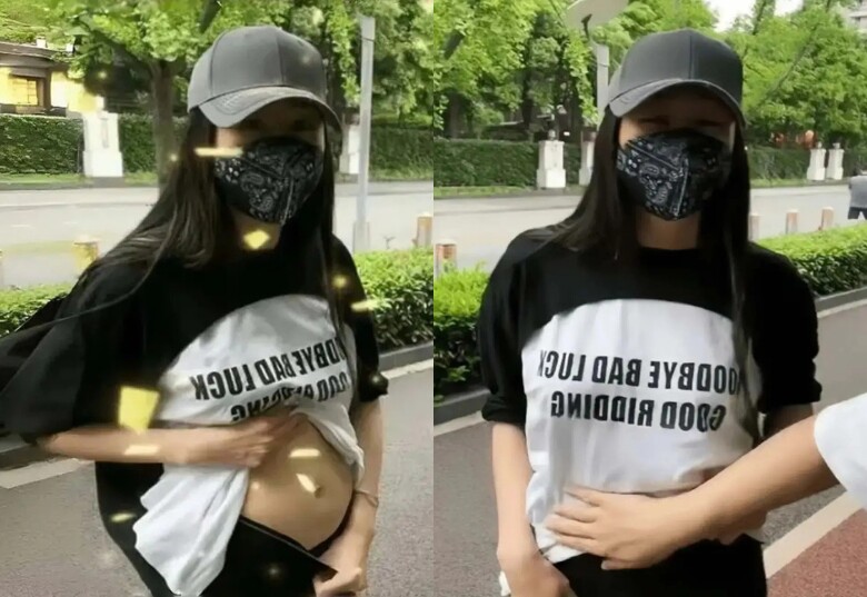 Trong hình ảnh mới nhất, nàng á hậu bất ngờ vén áo để lộ bụng to bất thường.