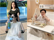 Bà bầu - Đoàn Di Băng lộ bụng khi cầm bình oxy, ngồi xe lăn đi chơi lễ: Chồng phản hồi nghi vấn có em bé