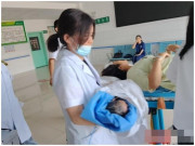 Bà bầu - Đau bụng sau bữa trưa, cô gái vào viện và đẻ luôn 1 bé trai, trước đó không hề biết mình mang bầu