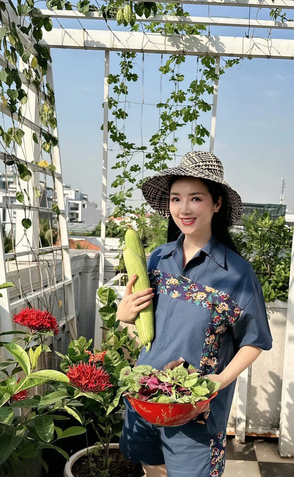 Giang My harvesting vegetables from her garden