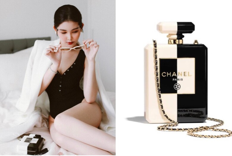 Một chiếc túi khác có kiểu dáng độc đáo không kém đó là Resin amp; Gold-Tone Metal White amp; Black Evening Bag, lấy cảm hứng từ chai nước hoa No 5 kinh điển của Chanel, giá bán 13.500 USD (khoảng 305 triệu đồng) được Ngân Anh không tiếc tiền sắm về.