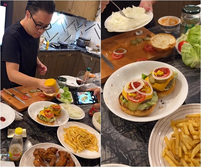 Bàn ăn bày biện cực kỳ chỉn chu: burger, khoai tây chiên, gà rán, rau củ… Victor Vũ tự tay nặn sốt, thêm hành tây, dưa leo và phô mai lên burger.