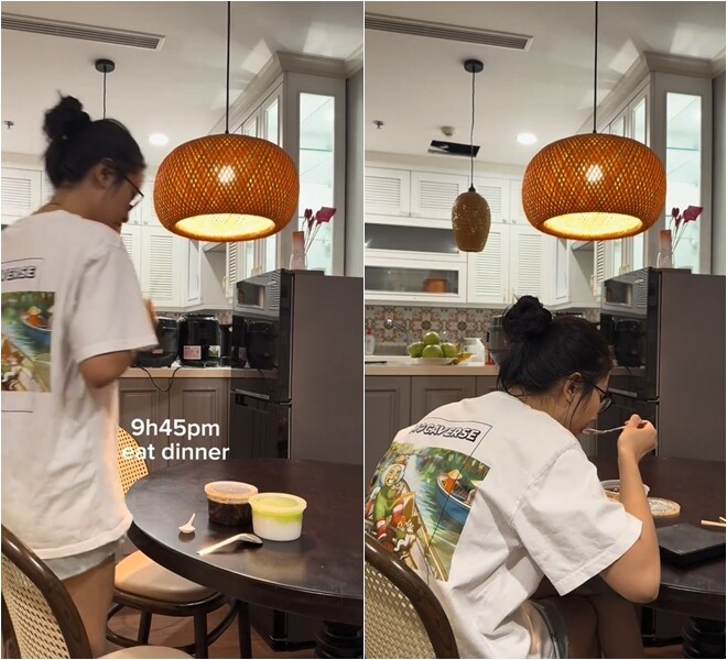 Phòng ăn và bếp nối liền, sử dụng đèn mây tre thả trần ánh vàng ấm – một lựa chọn vừa mang tính trang trí vừa giúp bữa ăn trở nên thư giãn hơn.