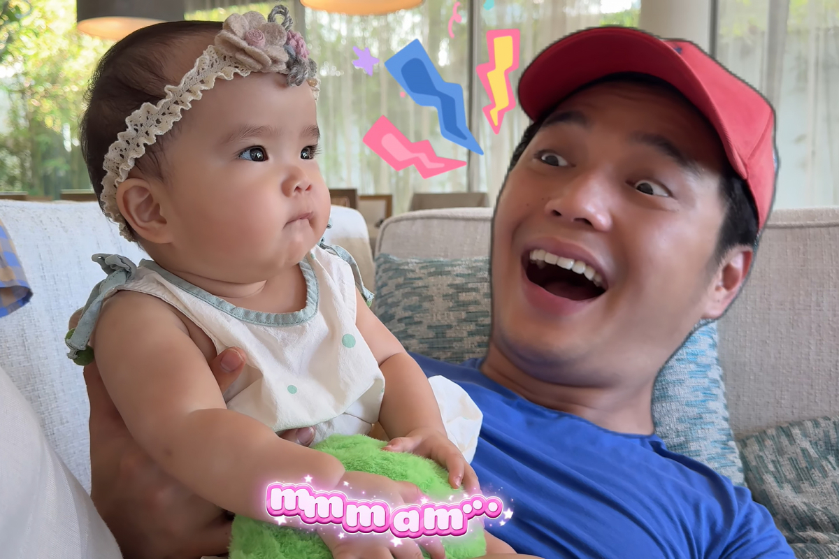 Đặt tiểu công chúa ngồi trên bụng mình, đầu bếp Huy Trần - ông xã Ngô Thanh Vân - hướng dẫn bé nói mama và tỏ ra bất ngờ khi Gạo bắt chước thành công.