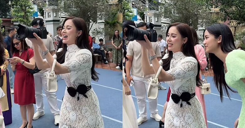 Minh Thu chụp ảnh cho Việt Hoa - Trọng Trí cùng các quan khách dự buổi lễ.
