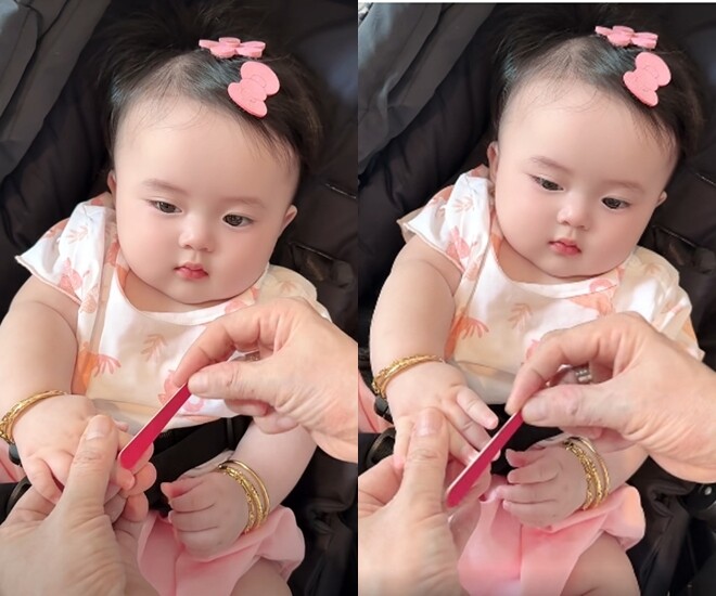 Bé Lương Bình Thụy Yên được bố chăm chút, dũa từng móng tay.