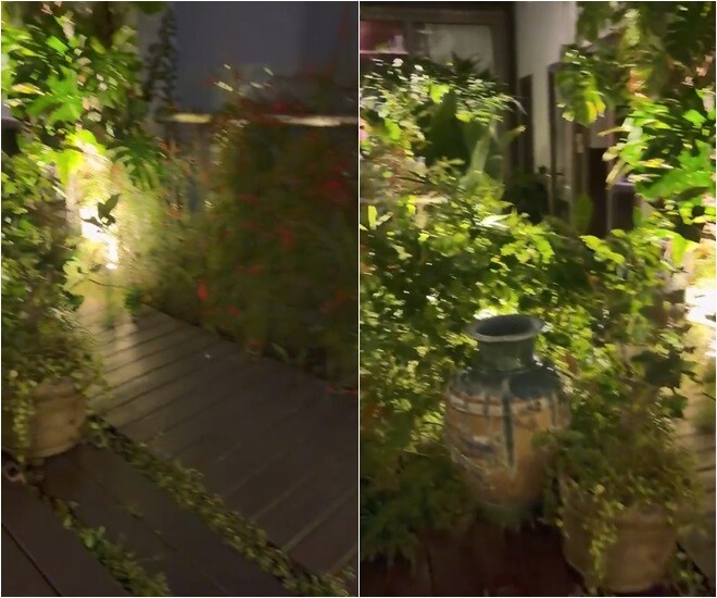 Các lối đi nhỏ quanh co trong vườn được bố trí nhiều chậu gốm cổ và chum nước trang trí xen kẽ giữa các lùm cây bụi. Thiết kế này vừa tạo cảm giác bí ẩn, kích thích sự khám phá, vừa mang lại sự riêng tư tối đa cho từng góc nhỏ.