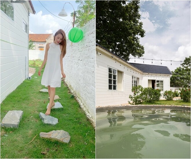 House during the day with natural stone driveway