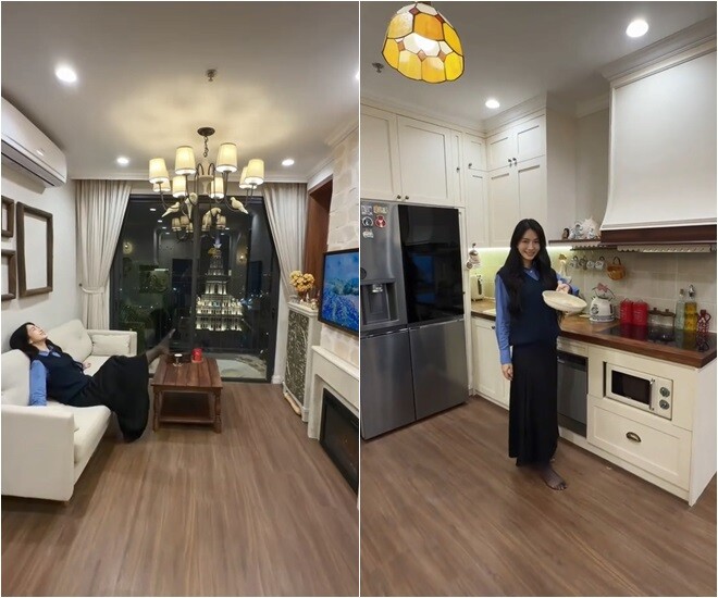 Phòng khách được thiết kế mở với hệ thống đèn chùm tinh xảo cùng tông màu trắng kem nhã nhặn. Sự xuất hiện của tivi màn hình lớn và ghế sofa êm ái biến nơi đây thành khu vực giải trí lý tưởng cho cô nàng độc thân.