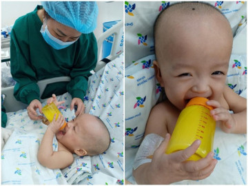 Song Nhi không còn cần thở oxy, tự cầm bình uống sữa