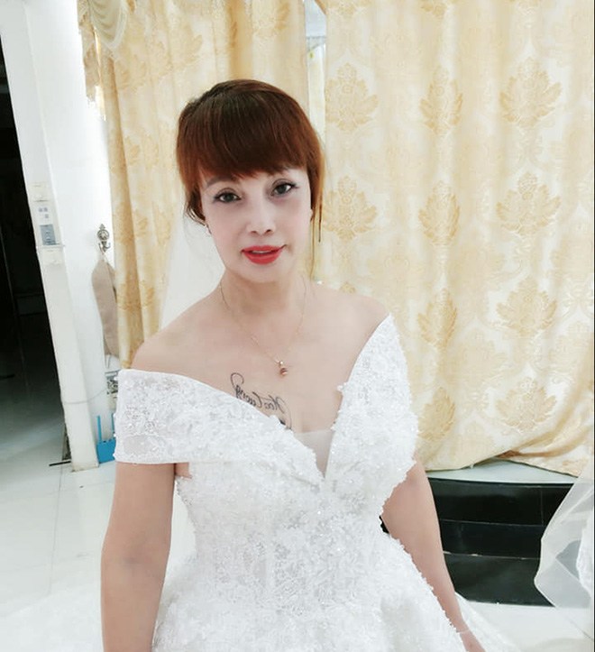 Cô dâu Thu Sao tung ảnh mặc váy cưới, nhan sắc như gái đôi mươi, CĐM tranh cãi gay gắt - 2