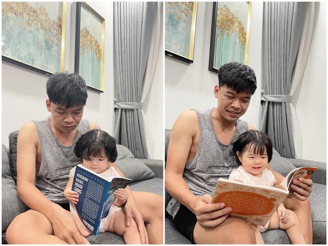 Con gái Trung Ruồi ngồi đọc sách rất chăm chú dù chưa biết đọc.