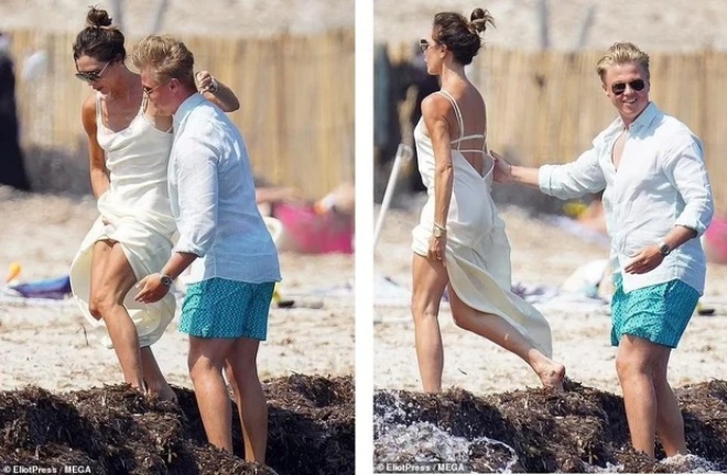 Victoria cũng được một người đàn ông lạ mặt bế bồng.