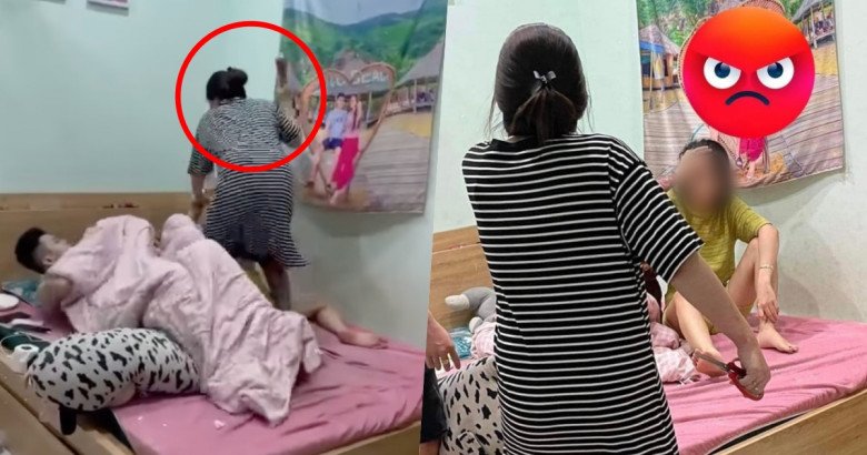 Người phụ nữ không kìm chế nổi cảm xúc đã kéo chăn ra, dùng chiếc chày gõ vào người nằm sát vách tường - được cho là nhân tình của chồng.